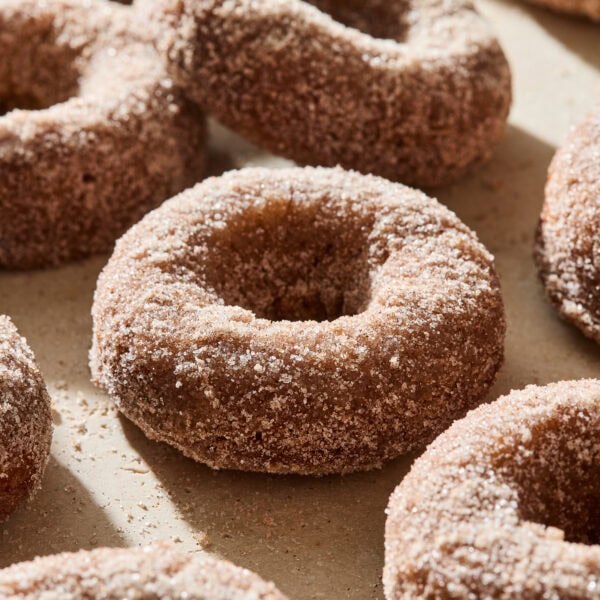 Baked donuts with cinnamon sugar mixture on top.