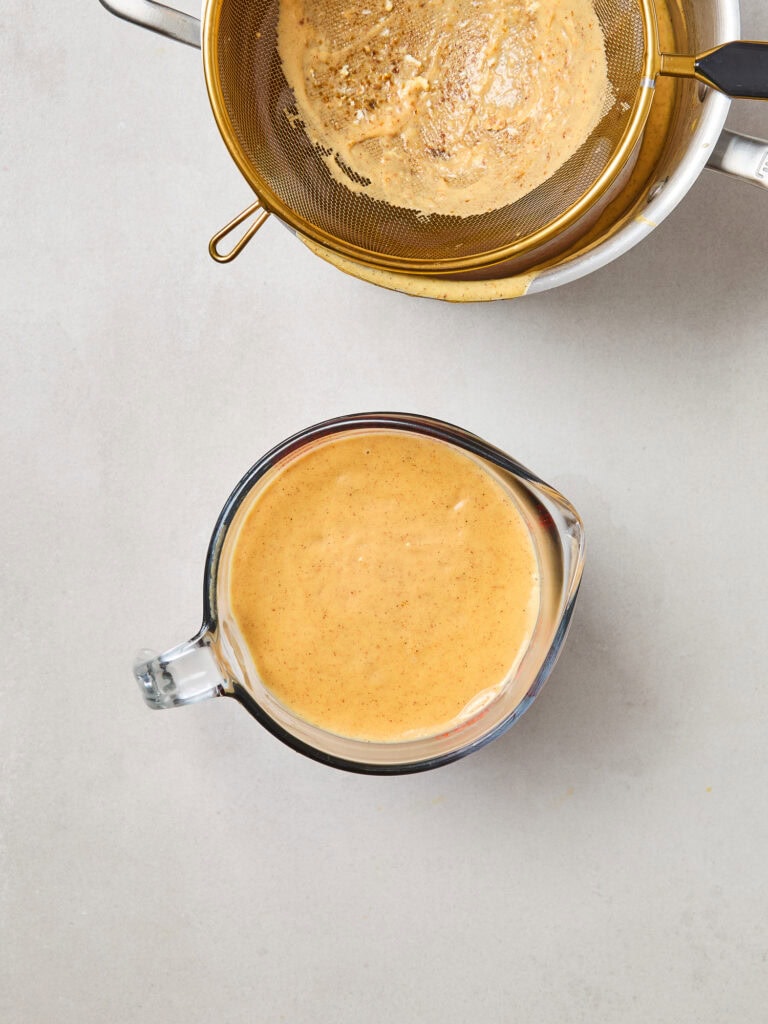 Pumpkin ice cream mixture after being strained.