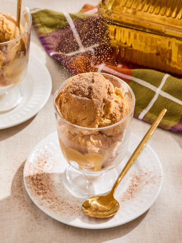 Pumpkin ice cream in a glass serving dish.