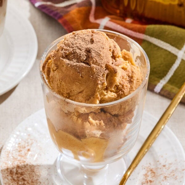 Pumpkin ice cream in a glass serving dish.
