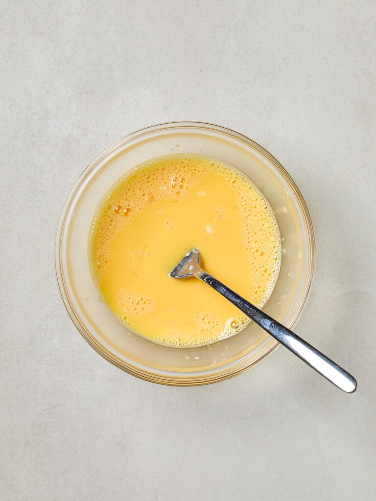 A bowl full of egg slurry mixture for ice cream.