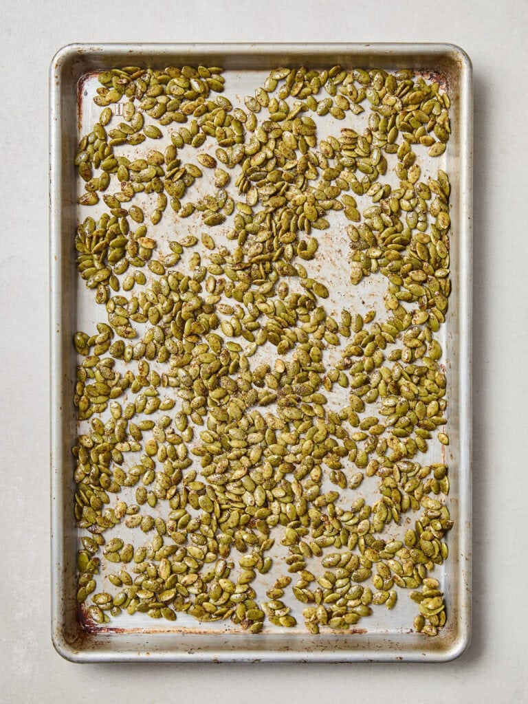 Pepitas on a baking sheet prior to roasting.