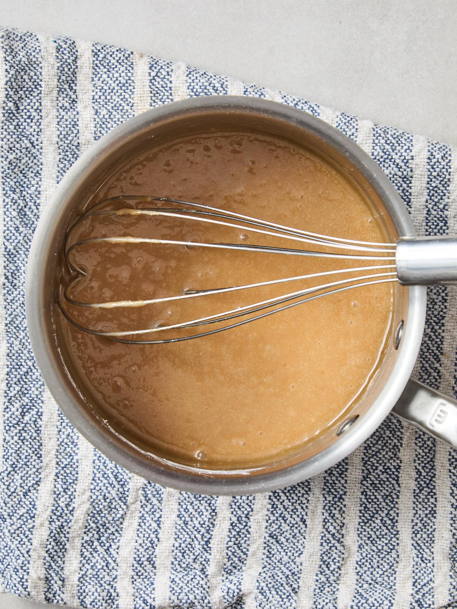 Prepared frosting for spiced apple cake.