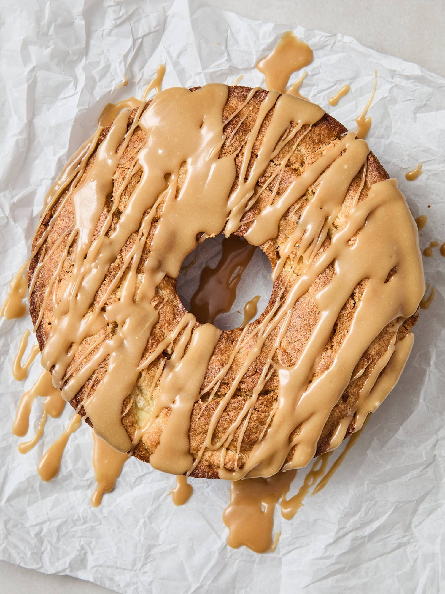 Glaze frosting on top of a baked cake for fall.