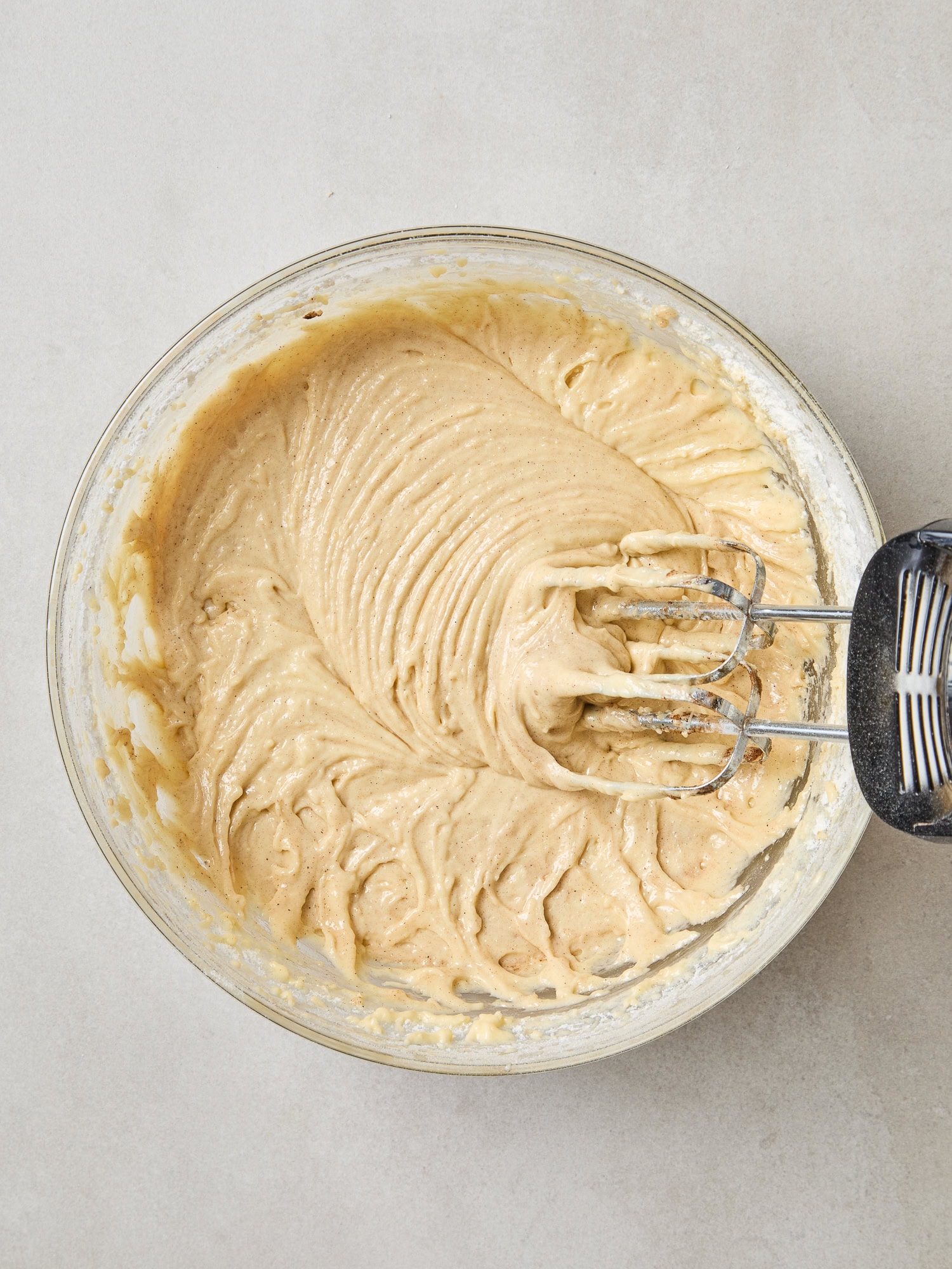 Cake batter after mixing with an electric hand mixer.