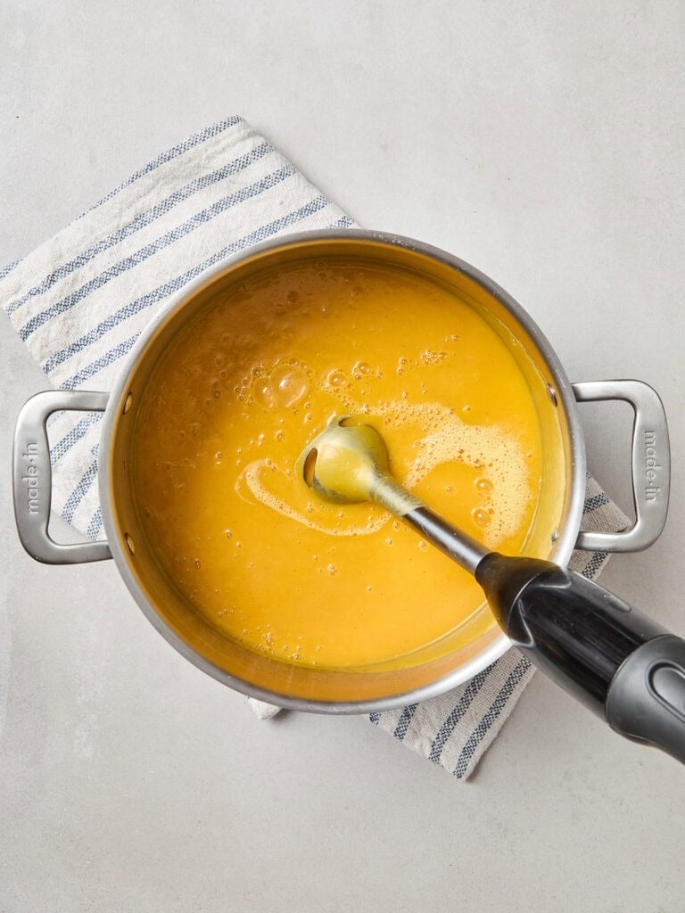 Squash and apple in a pot after being blended.