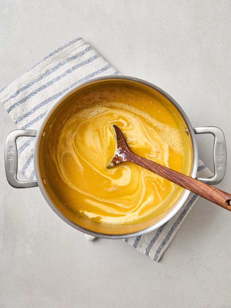 Blended fruit with added cream to form harvest squash soup.