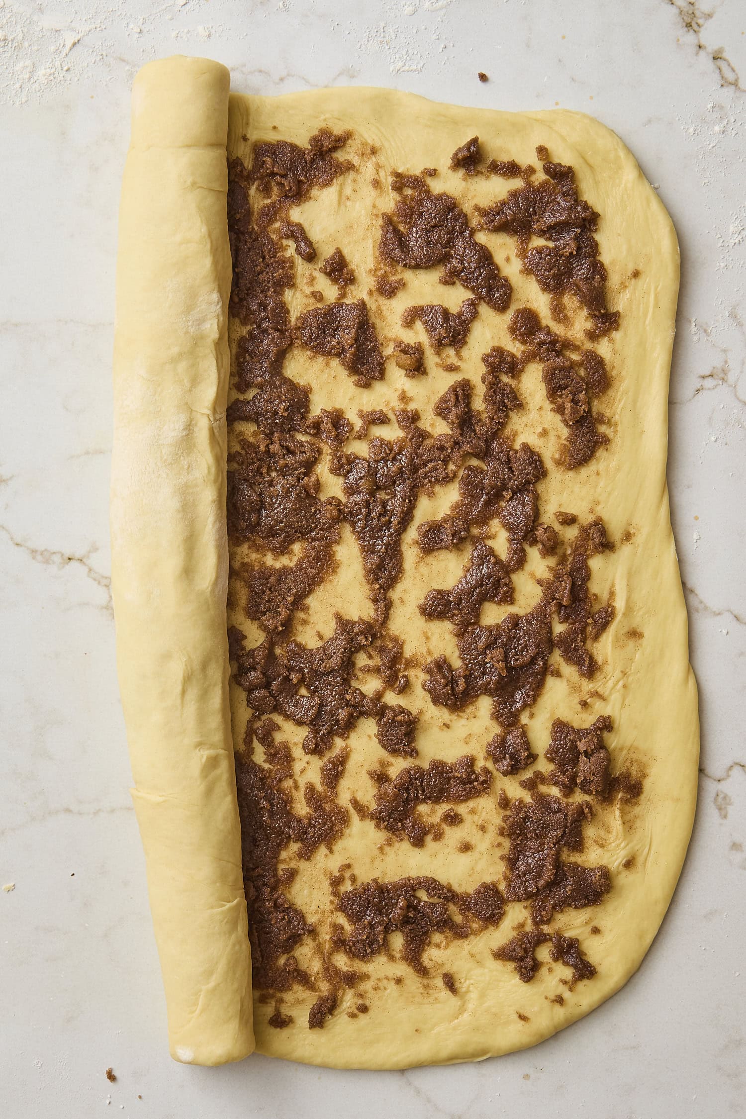 Rolled out dough with cinnamon brown sugar mixture.