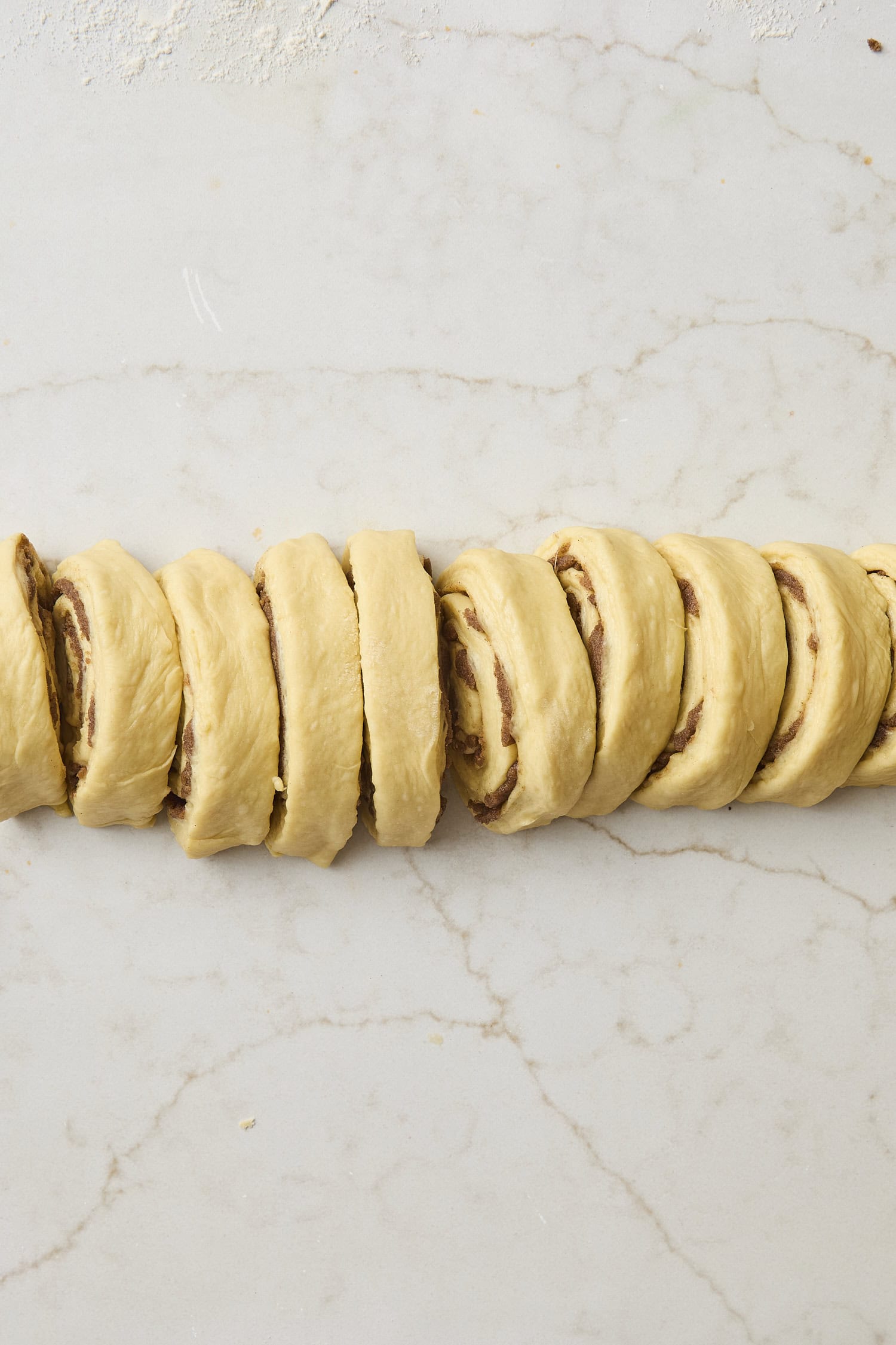 Sliced cinnamon roll dough.