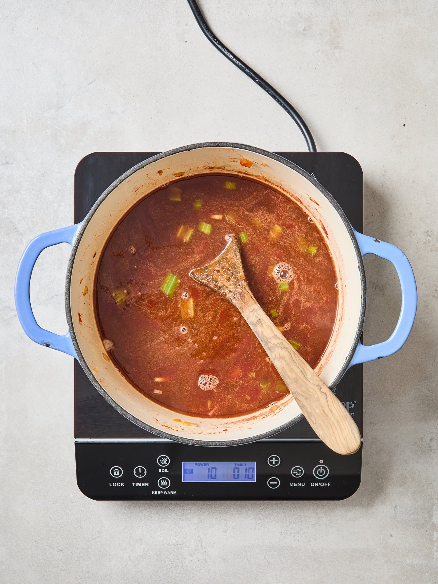 Liquid flavorings cooking in a Dutch oven for a classic pot roast.