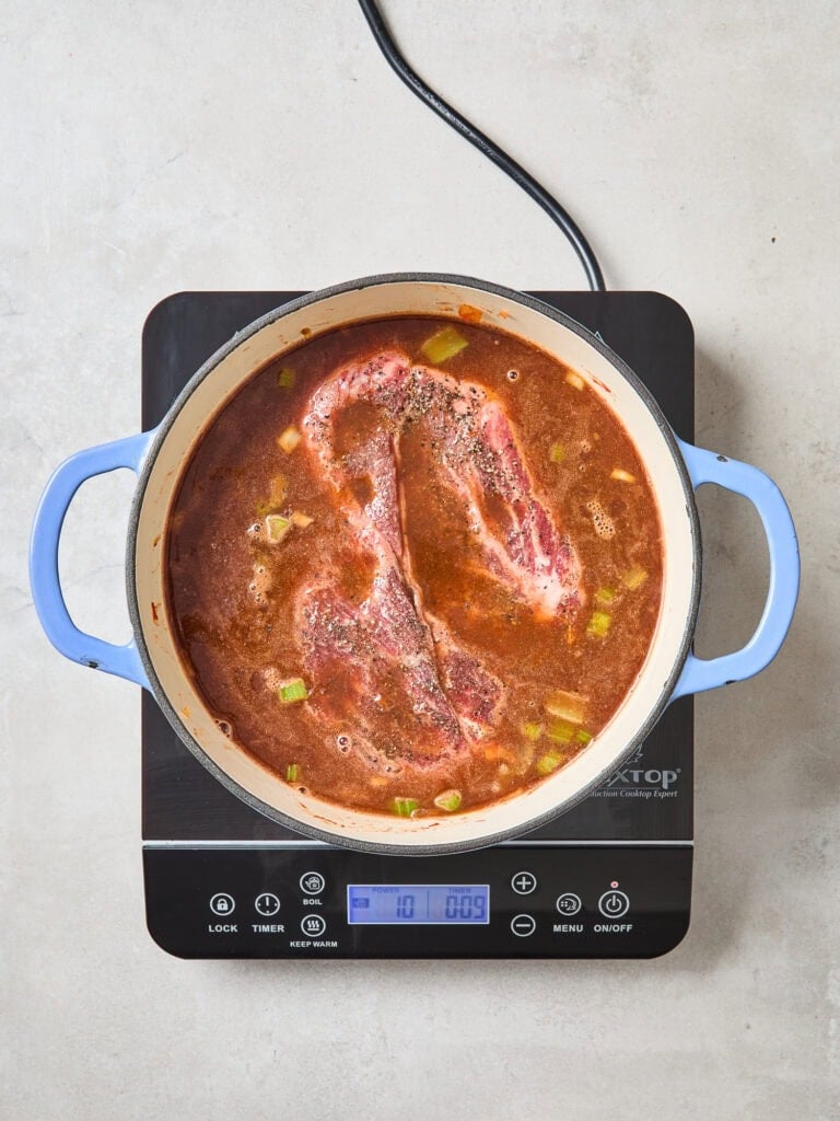 Chuck roast after being added to a Dutch oven to cook.