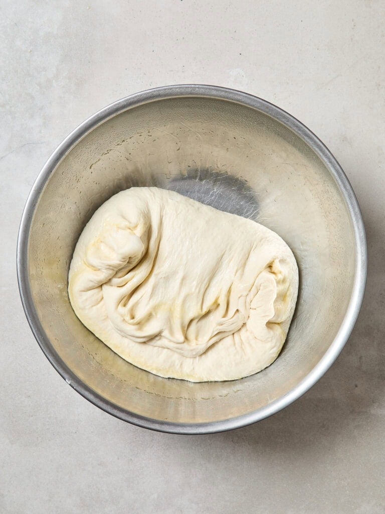 Punched-down bread dough after rising.