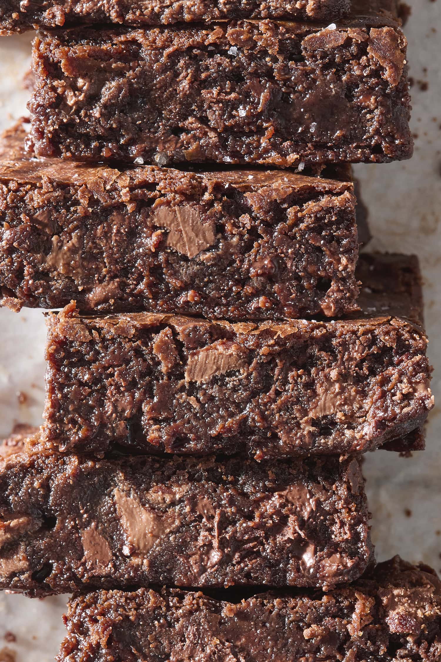 Stacked fudgy brownies showing their interior texture.