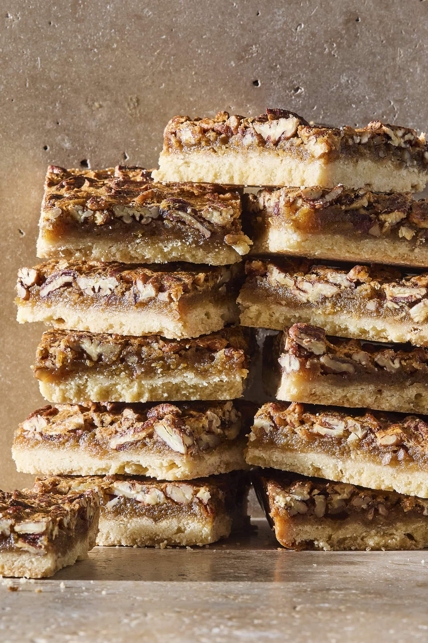 Stacks of pecan pie bars after being sliced.