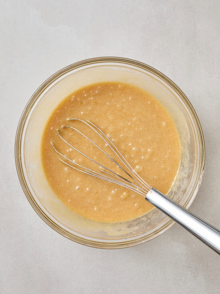 Wet ingredients for chocolate brownies after being mixed together.