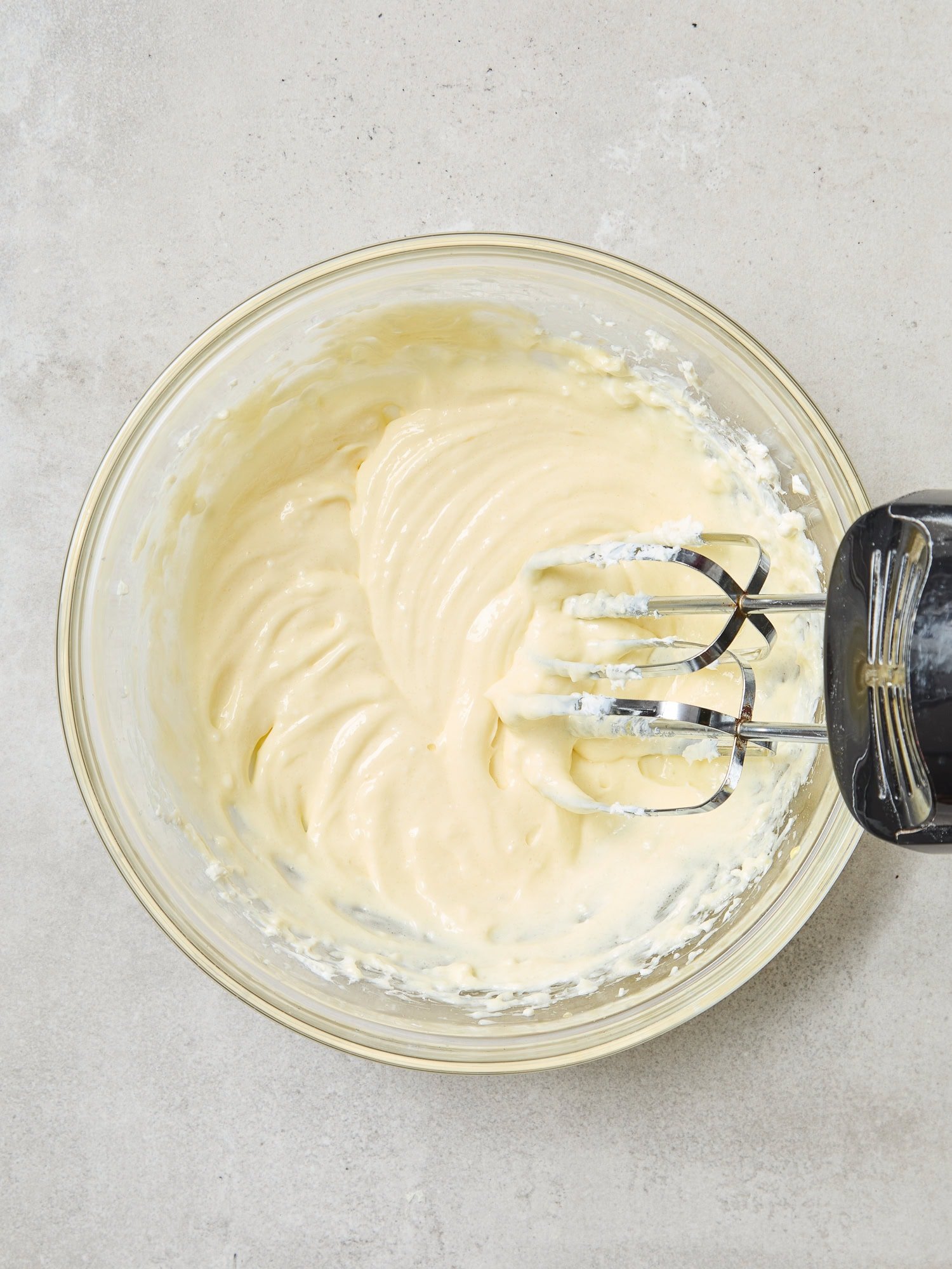 Whipped cheesecake batter for pumpkin cheesecake muffins.