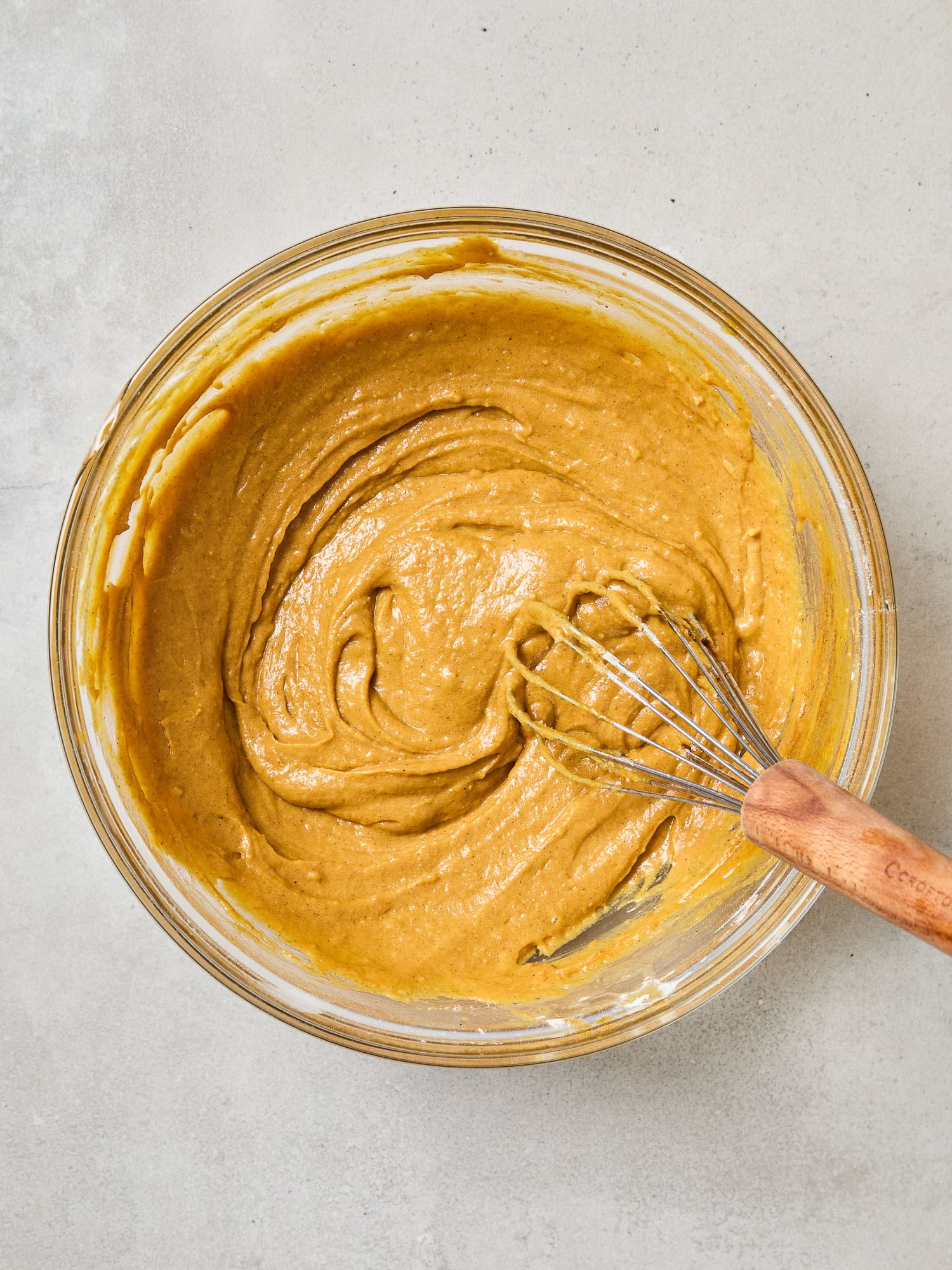 Pumpkin muffin batter in a bowl.