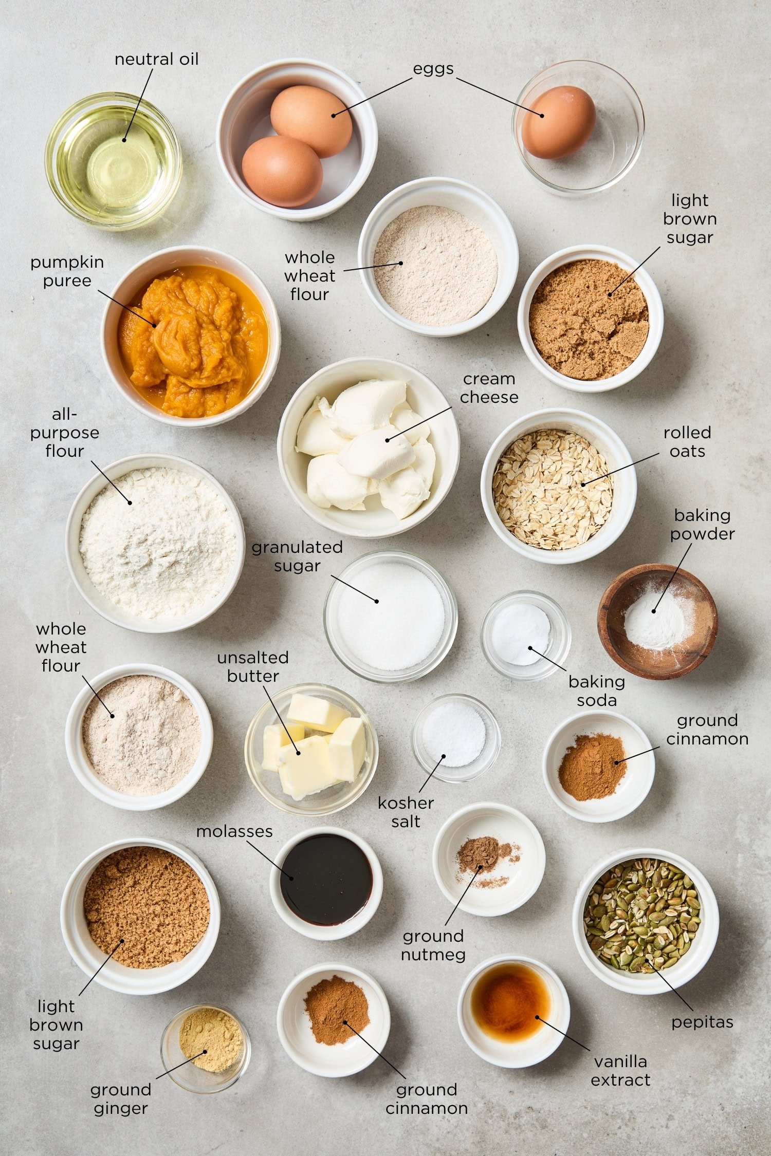 Surface filled with ingredients needed to make pumpkin cheesecake muffins.