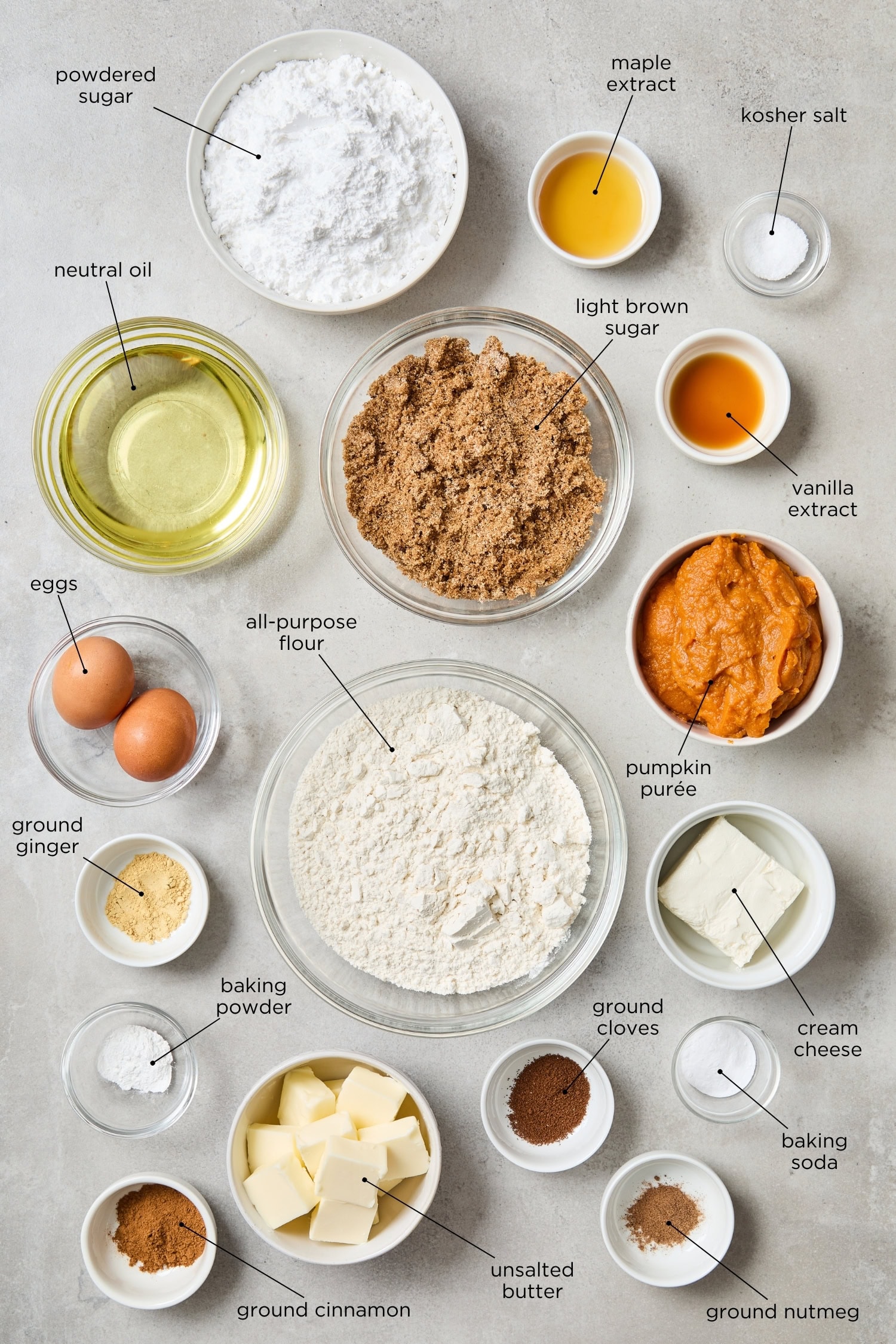 Concrete surface with ingredients needed to make pumpkin whoopie pies recipe.