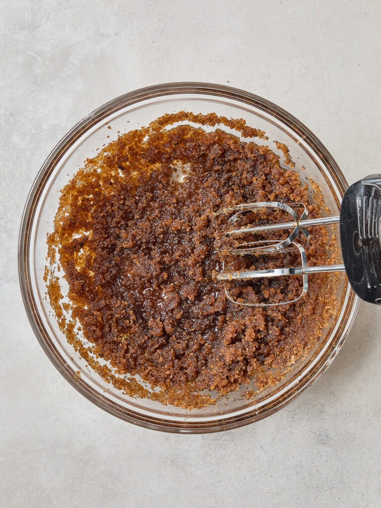 Oil and brown sugar mixed together in a bowl.