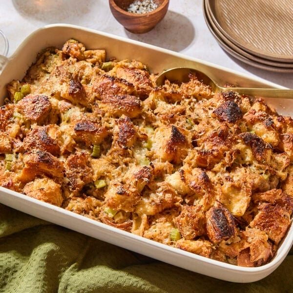 Baked croissant stuffing in a white baking dish ready for the holidays.