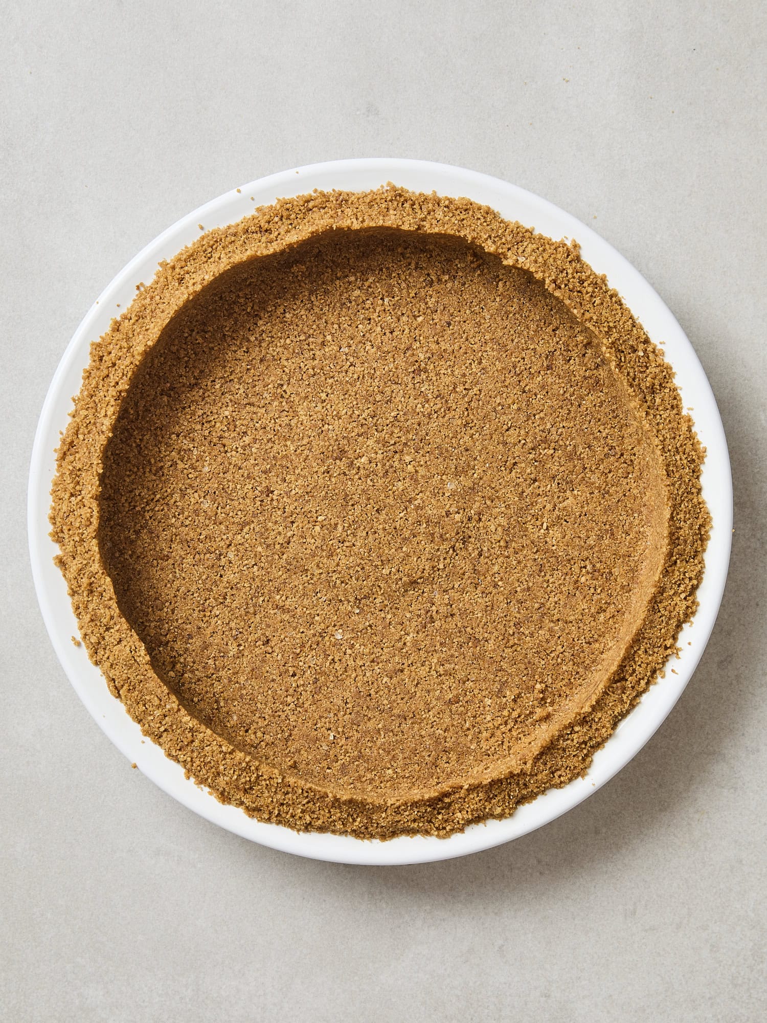 Crust for pumpkin pie after being baked.