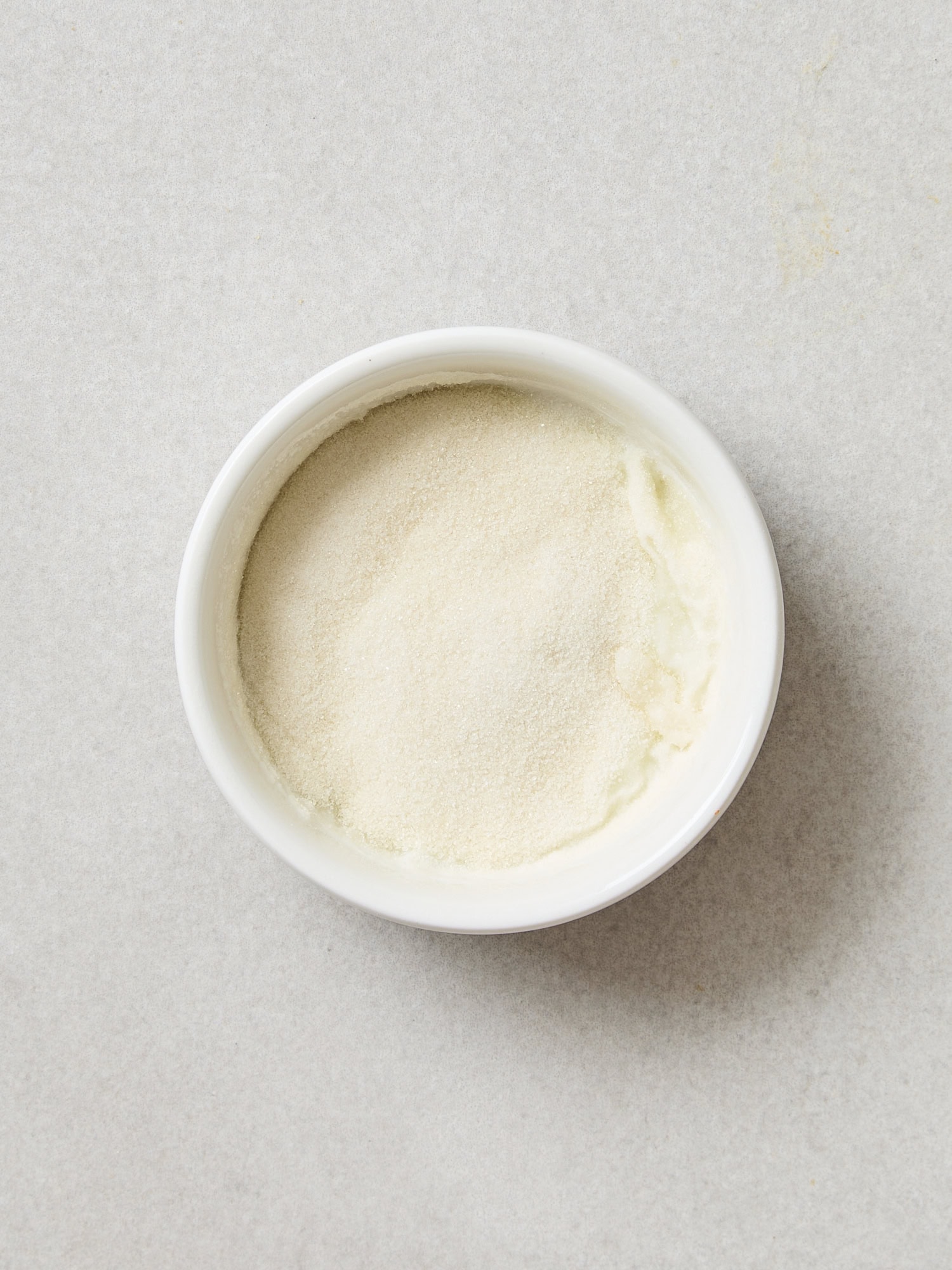 Blooming gelatin in whole milk in a bowl.