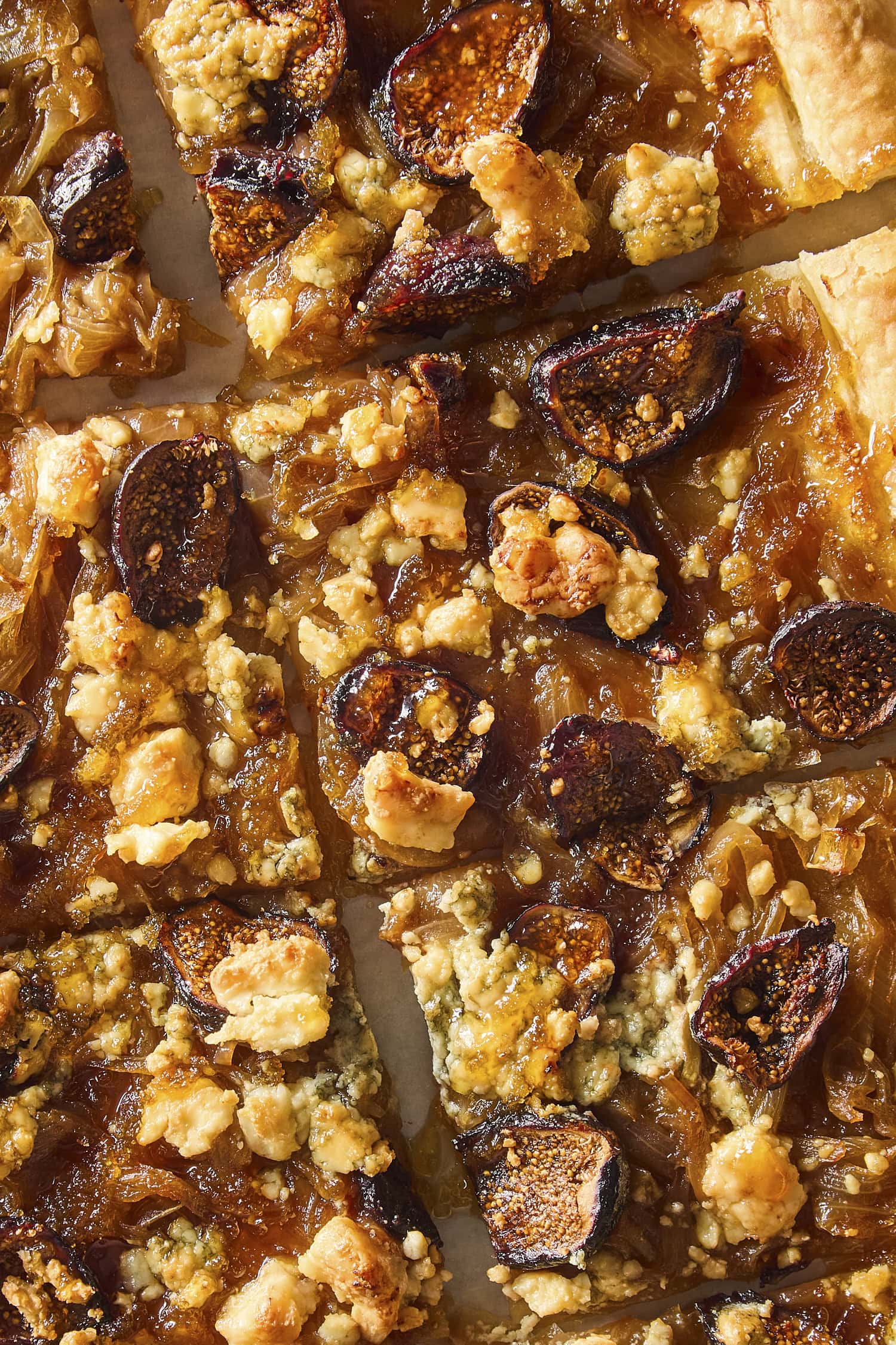 Onion tart with melted blue cheese and sliced figs drizzled with honey.