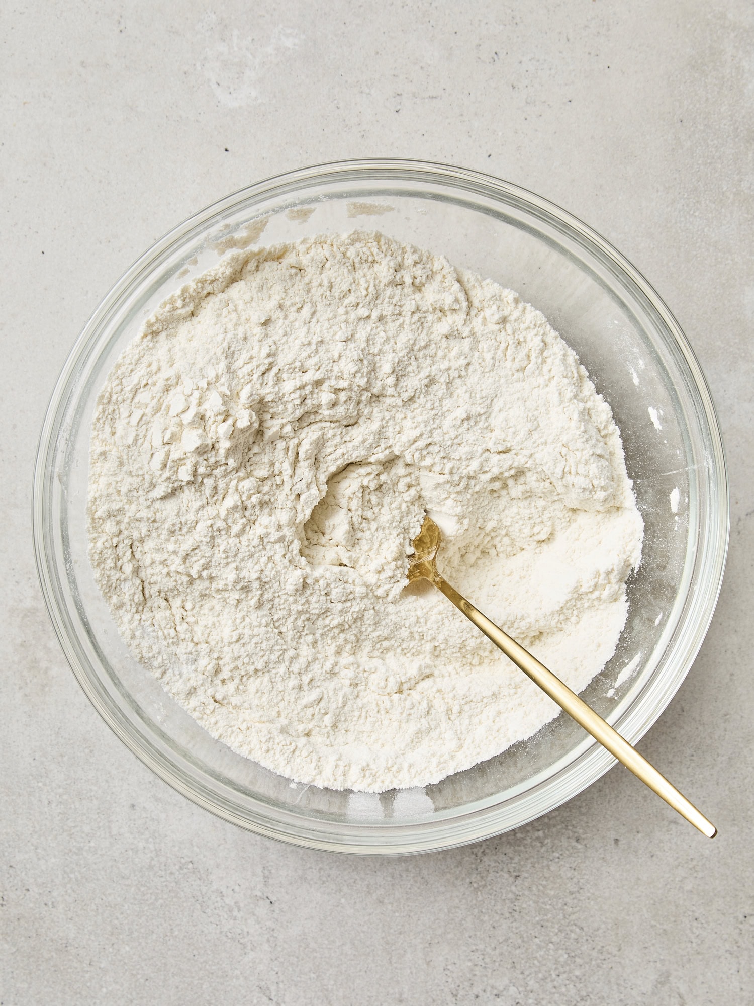 Mixture of flour for muffins in a glass bowl.