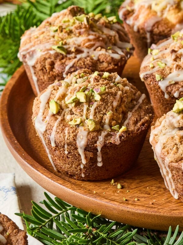 Baked pistachio muffin with glaze and pistachios on top.
