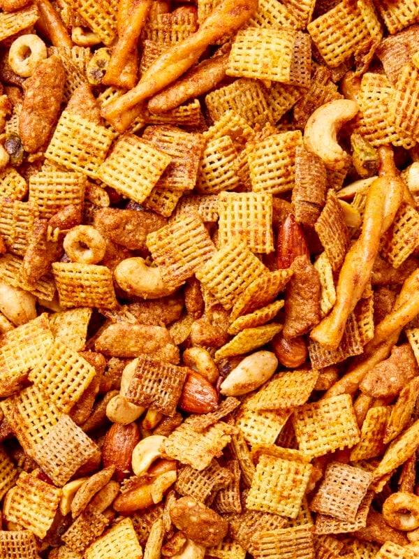 Mixture of cereal, pretzels, and nuts to form a smoky party mix.