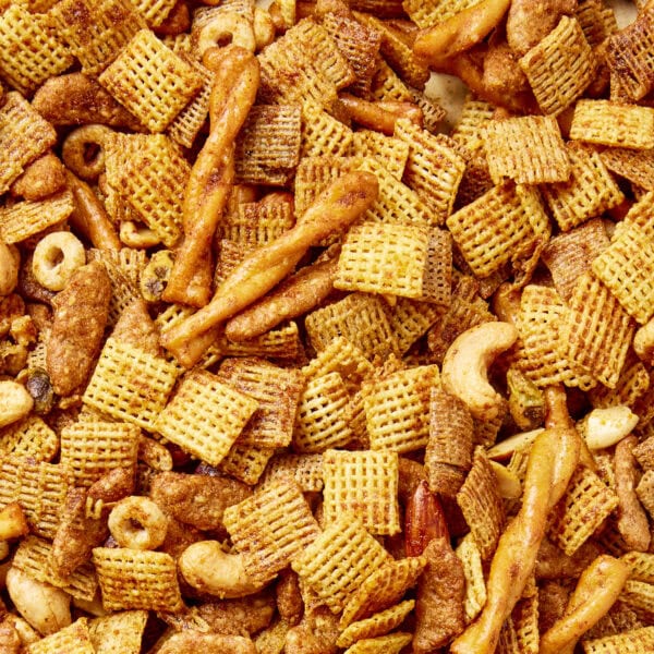 Smoky party mix made from a mixture of cereal, pretzels, and nuts.