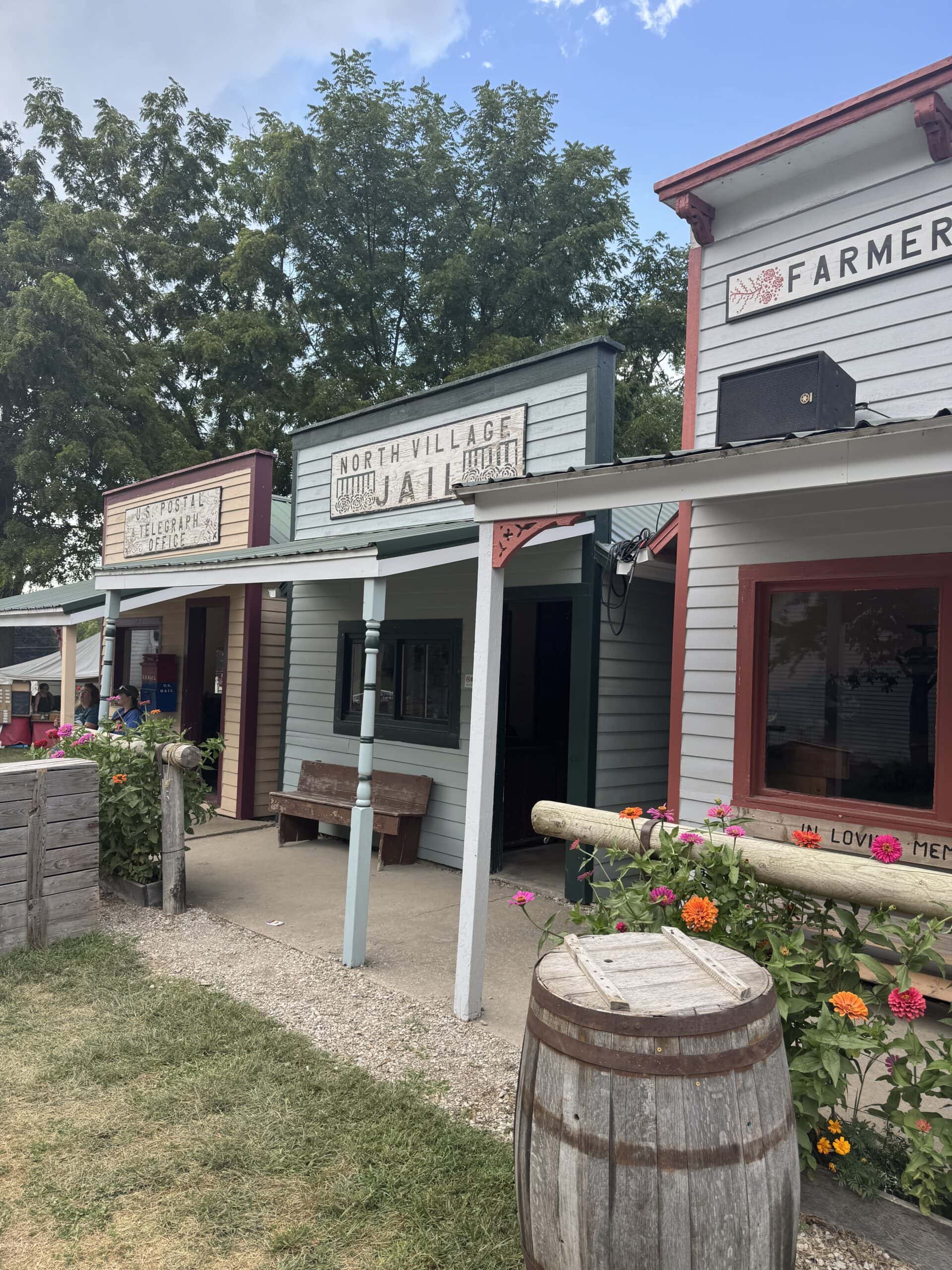 An old western village with storefronts.