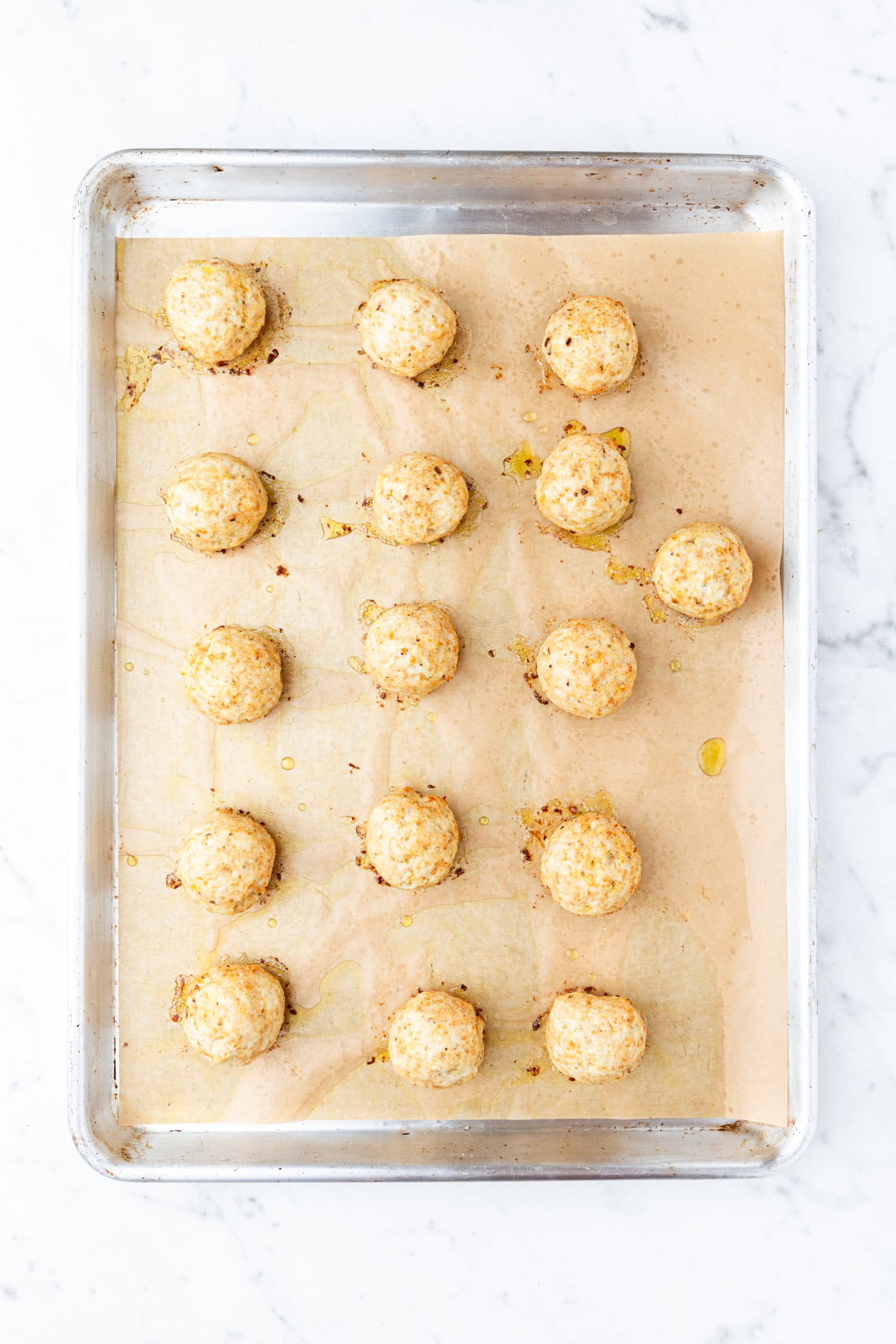 Chicken meatballs after baking on sheet pan.