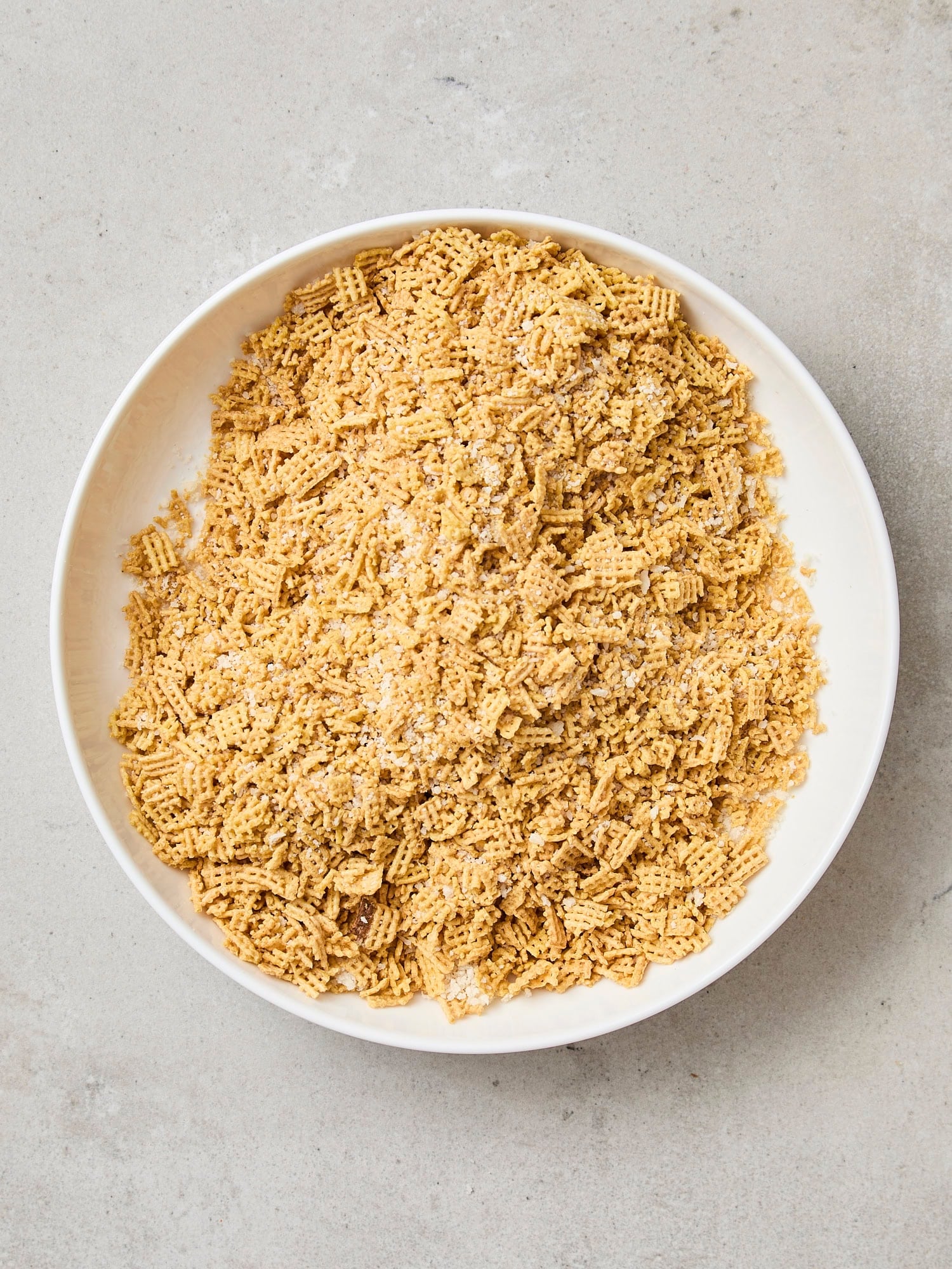 Bowl with crushed Chex cereal.