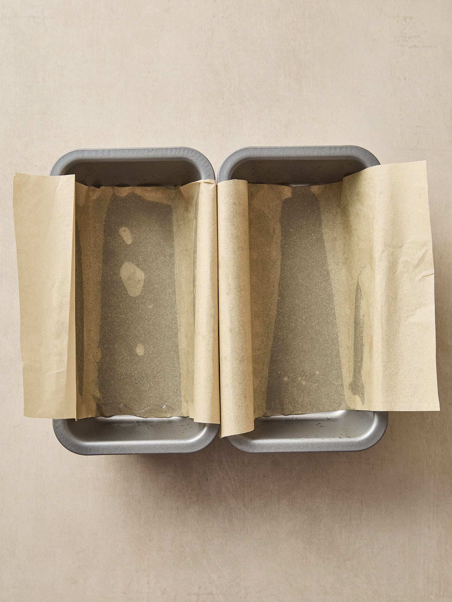 Two baking pans lined with parchment paper.