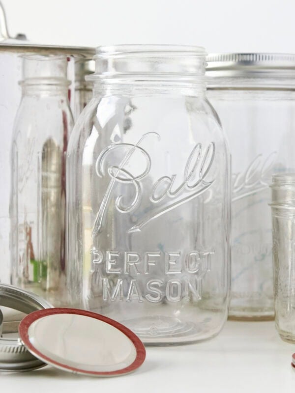 Glass jars, rings, and lids needed for canning.
