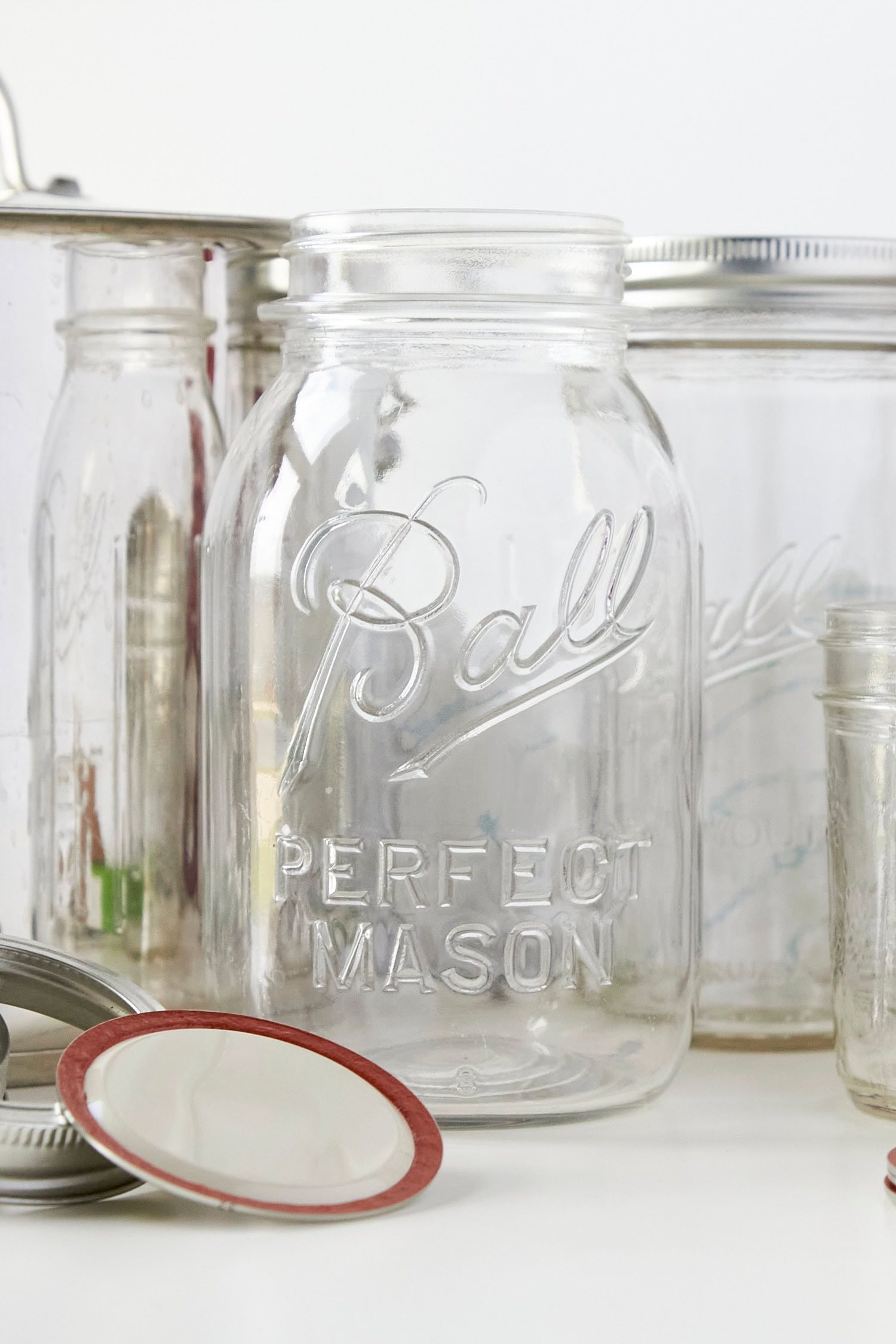 Glass jars, rings, and lids needed for canning.