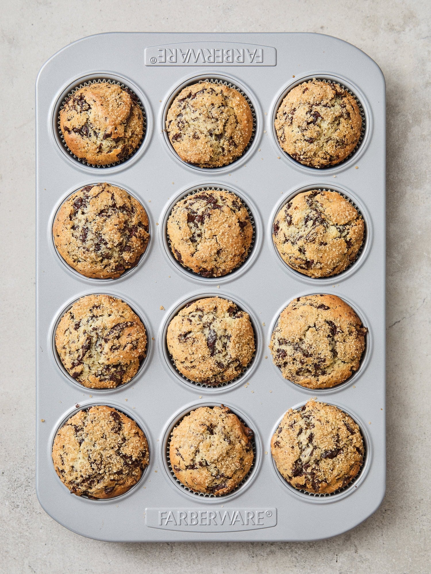 Baked chocolate muffins in a tin.