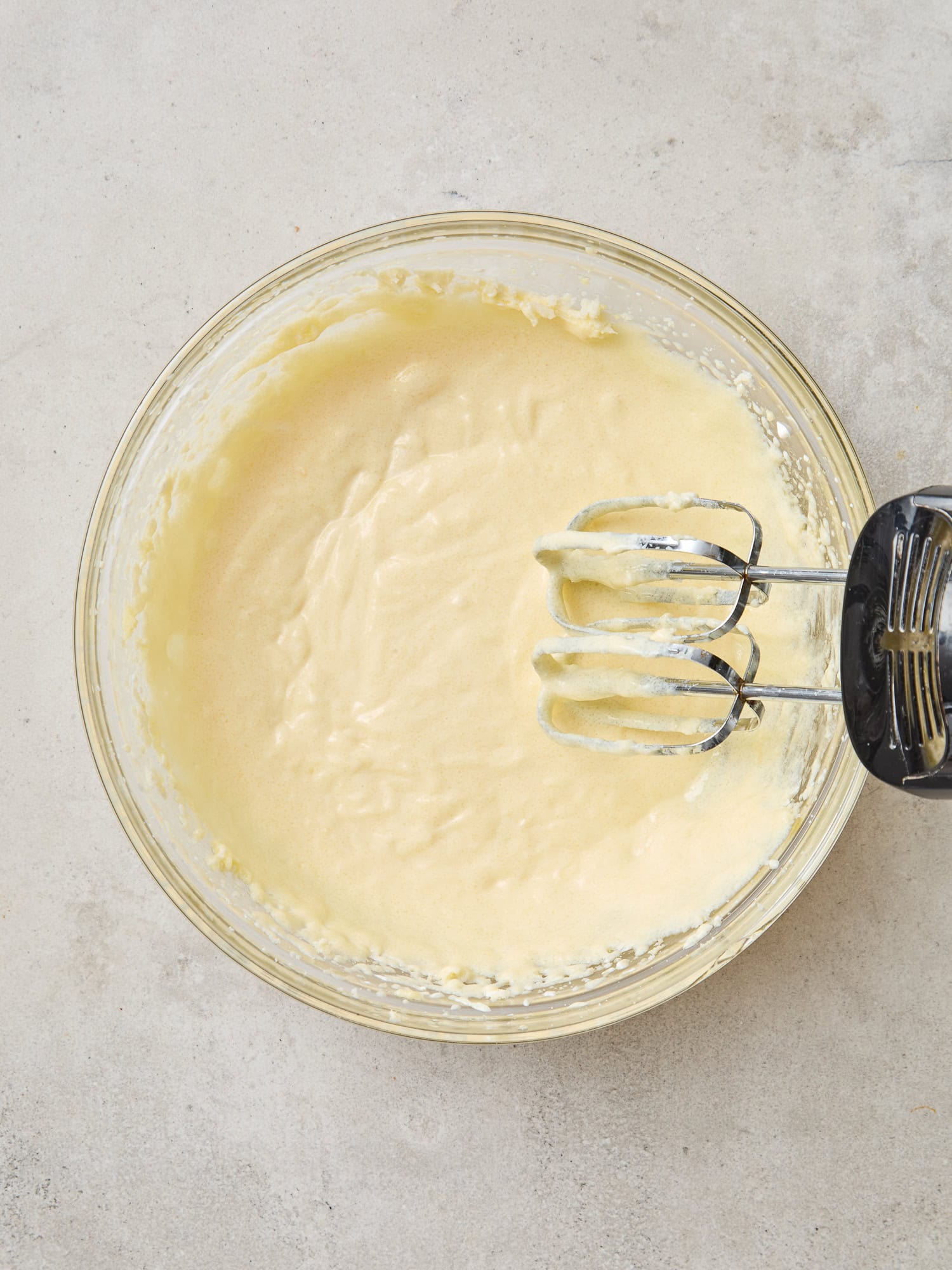 Muffin batter after being beaten with an electric hand mixer.