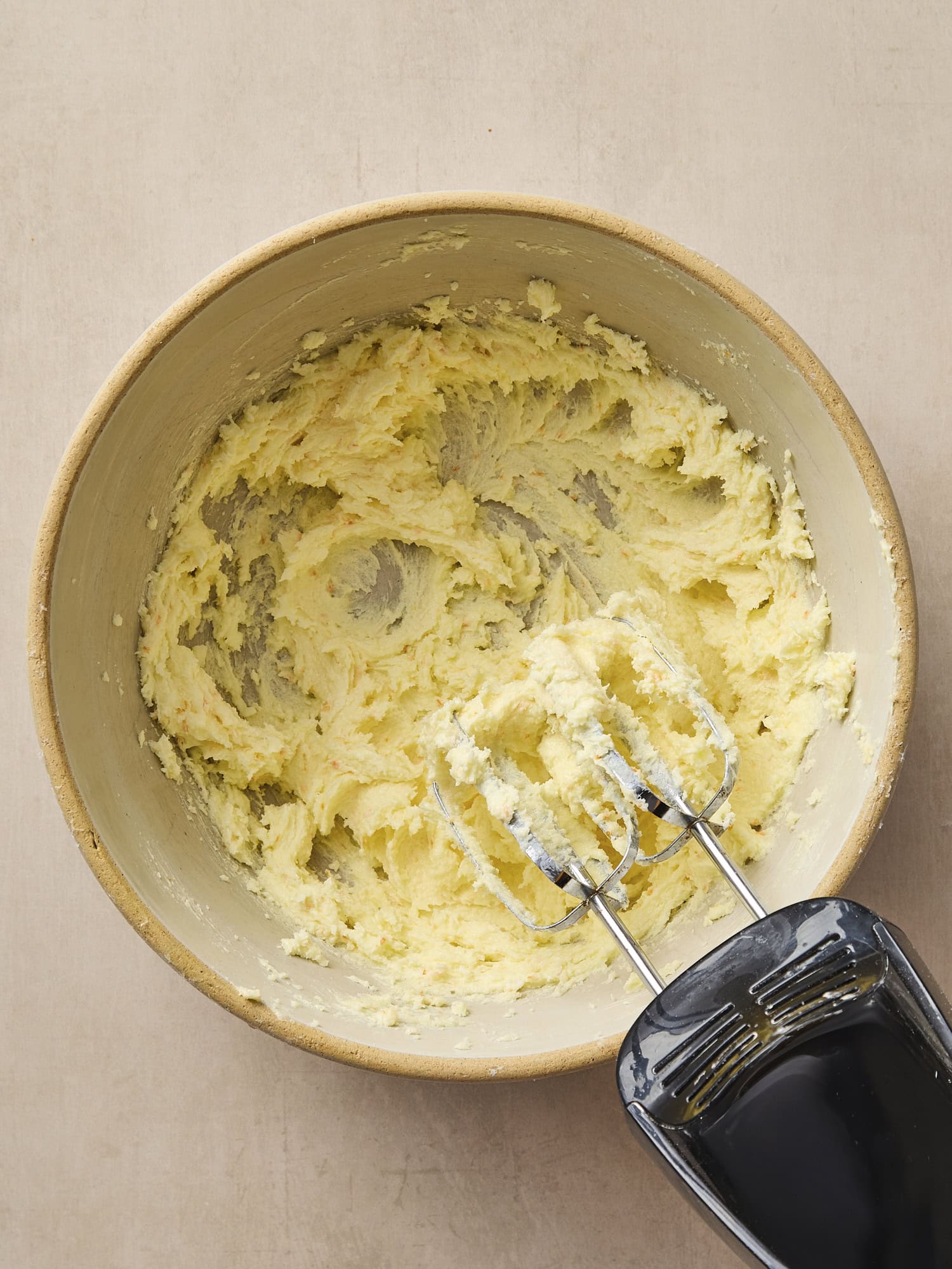 Bowl with creamed butter and sugar mixture.