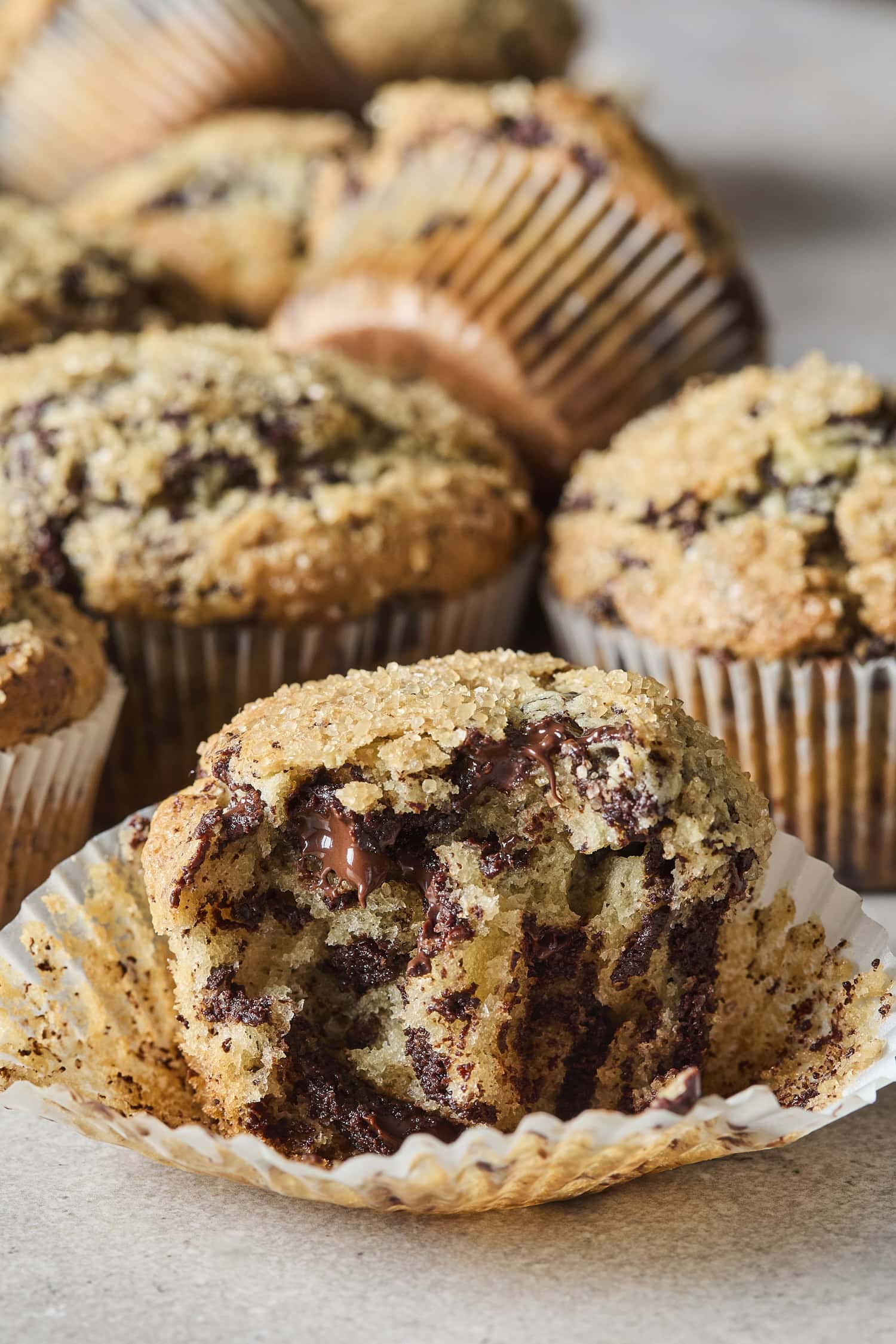 A muffin sliced in half, showing melted chocolate inside.