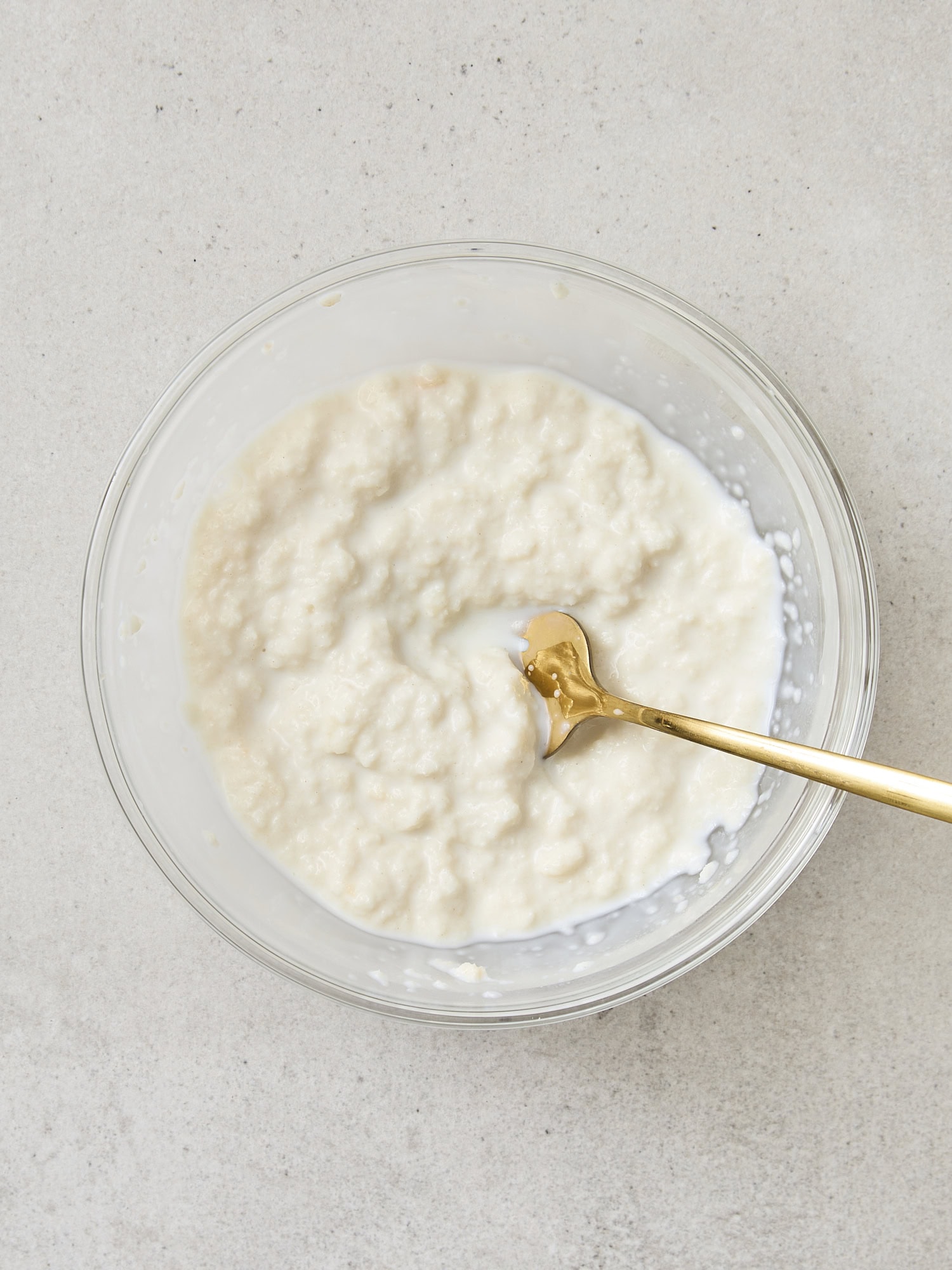 Bread and whole milk mixture for creating meatballs.