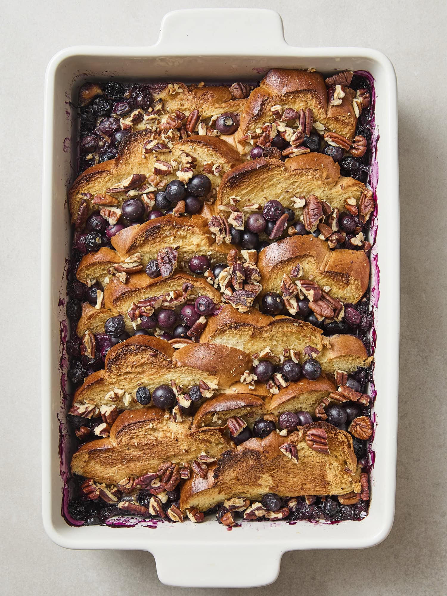 Baked overnight blueberry French toast with golden top.