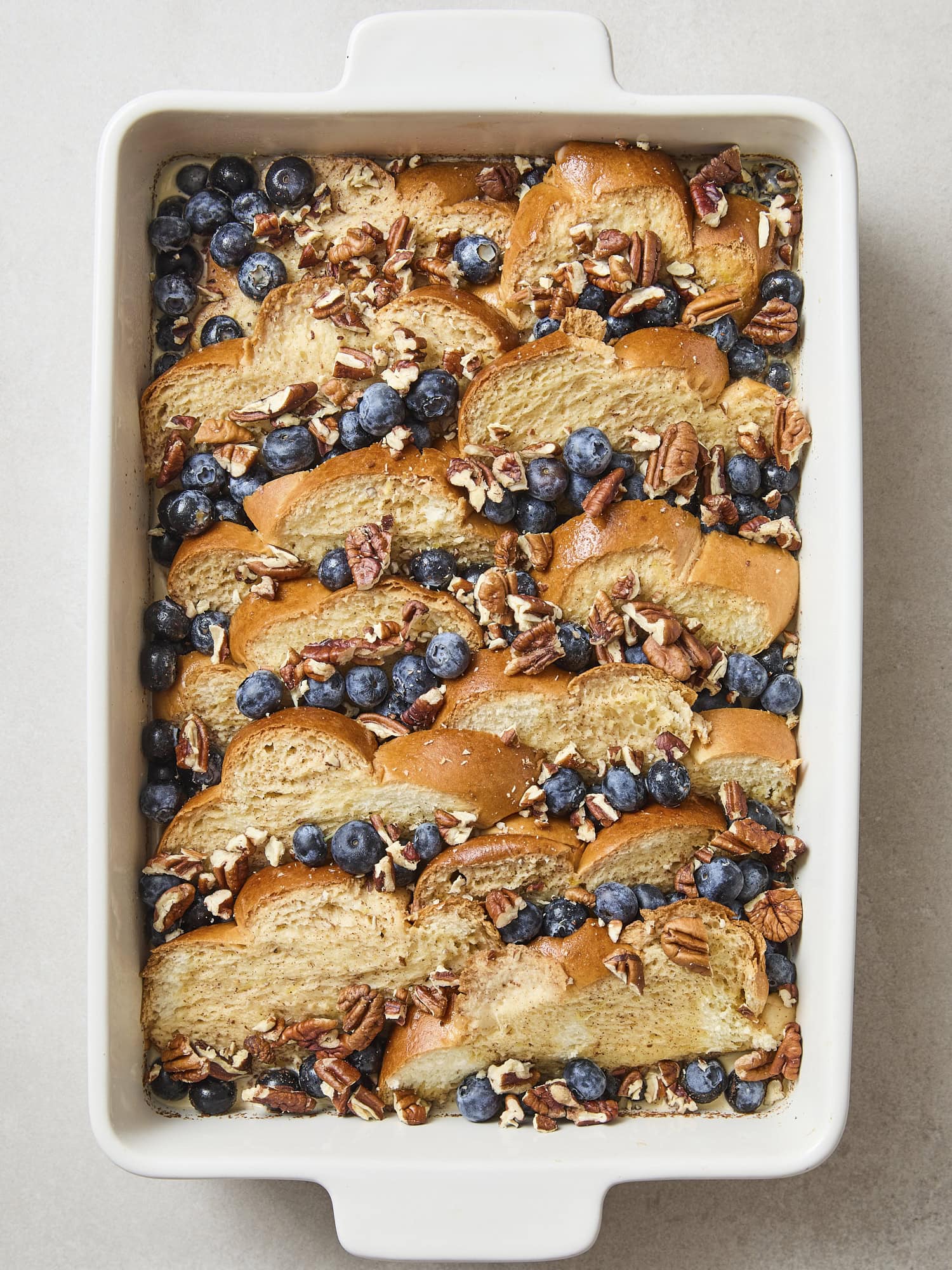 French toast with blueberries and pecans on top.