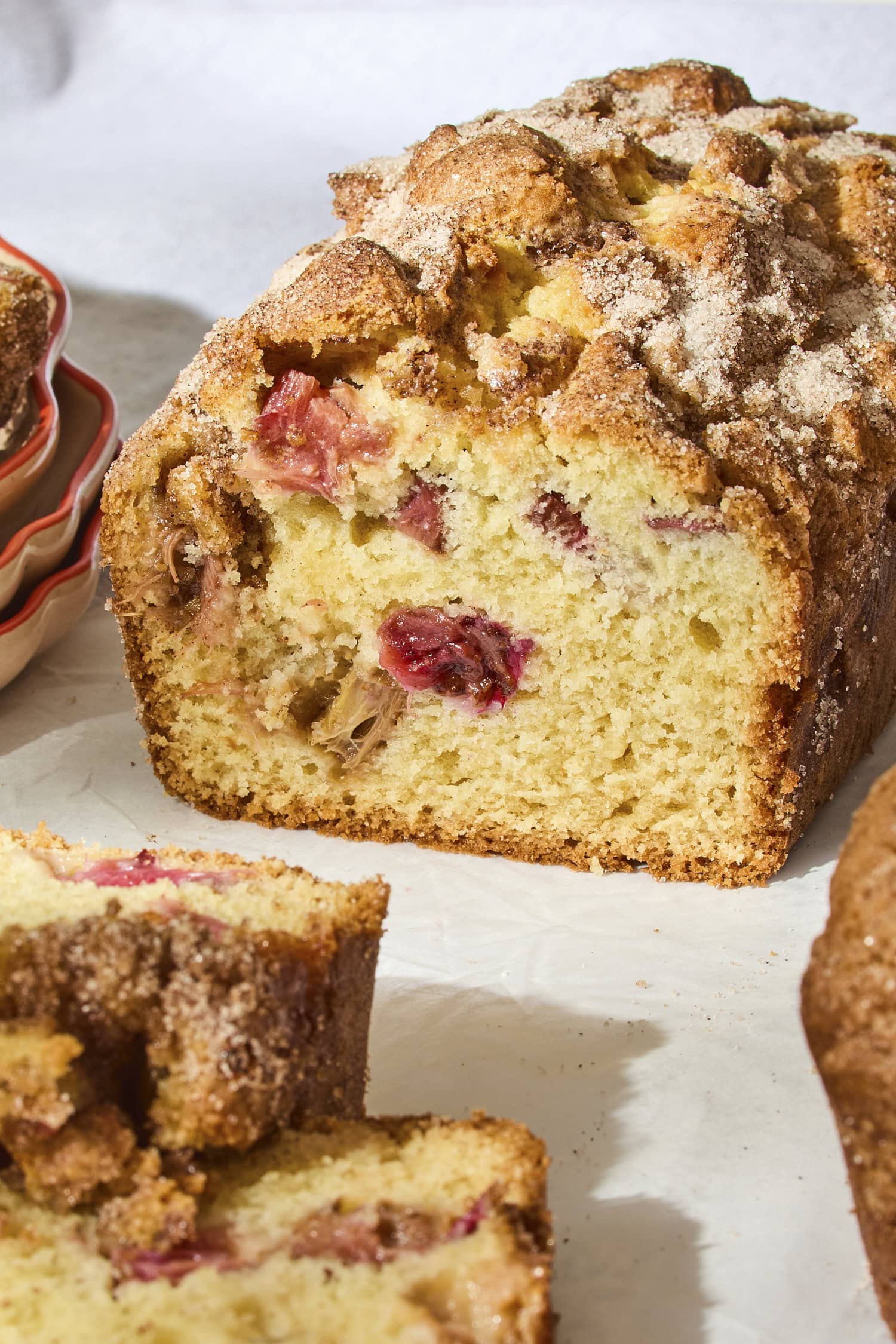 Interior texture of rhubarb buttermilk cake with crunchy cinnamon sugar topping.