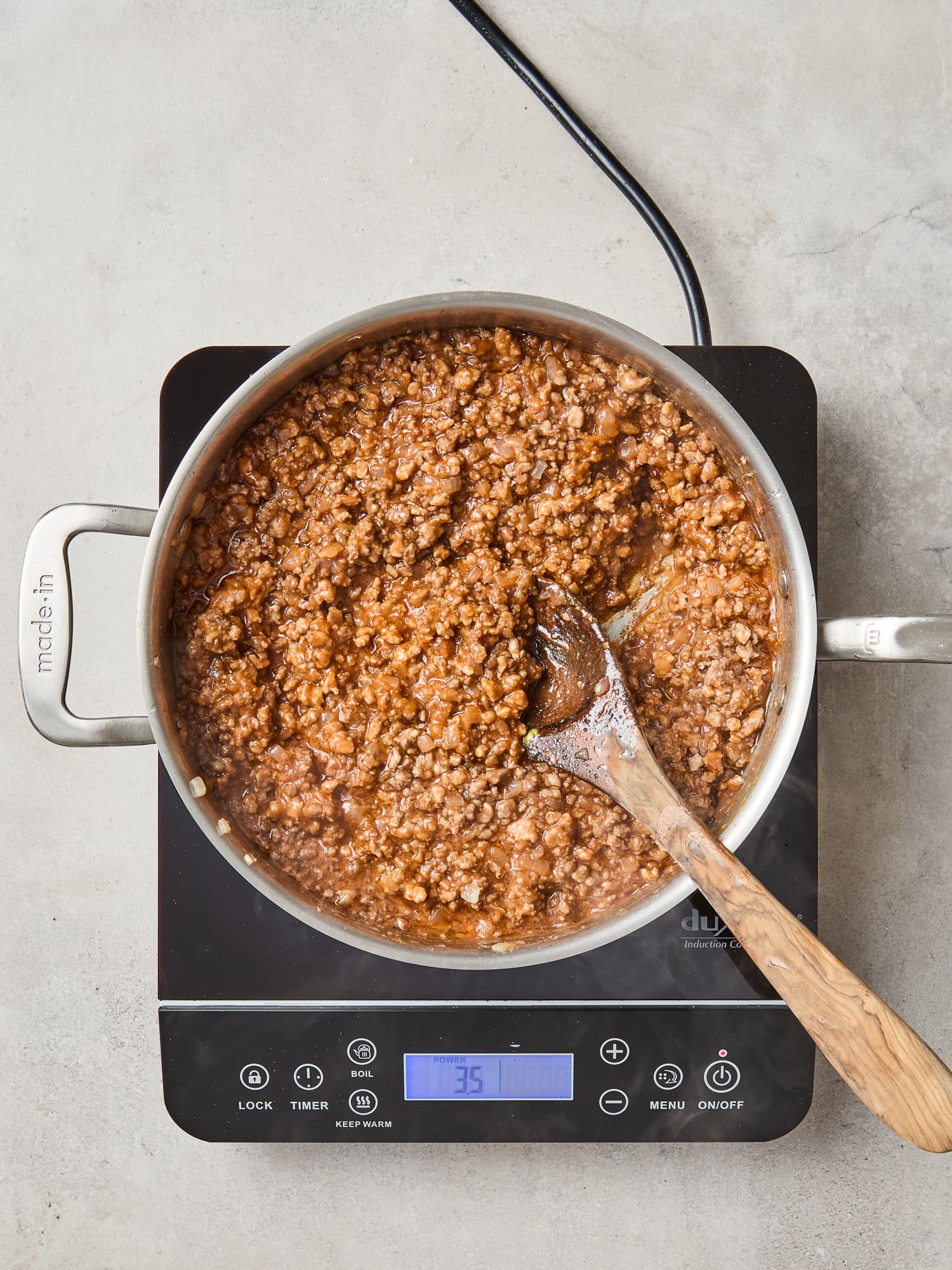 Sloppy Joe meat finishes cooking on a stovetop.
