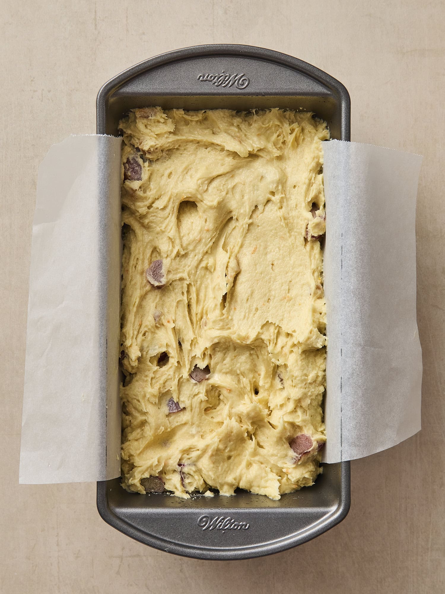 Baking pan with batter for rhubarb pound cake before going into the oven.