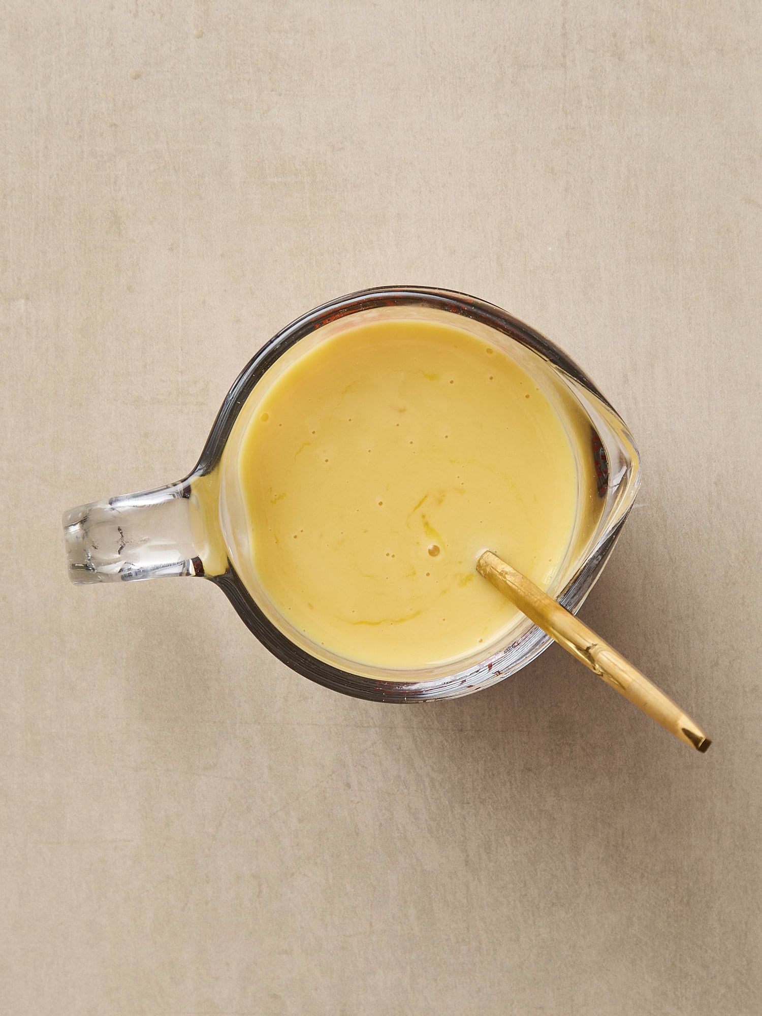 Wet ingredients mixed together in a measuring cup.