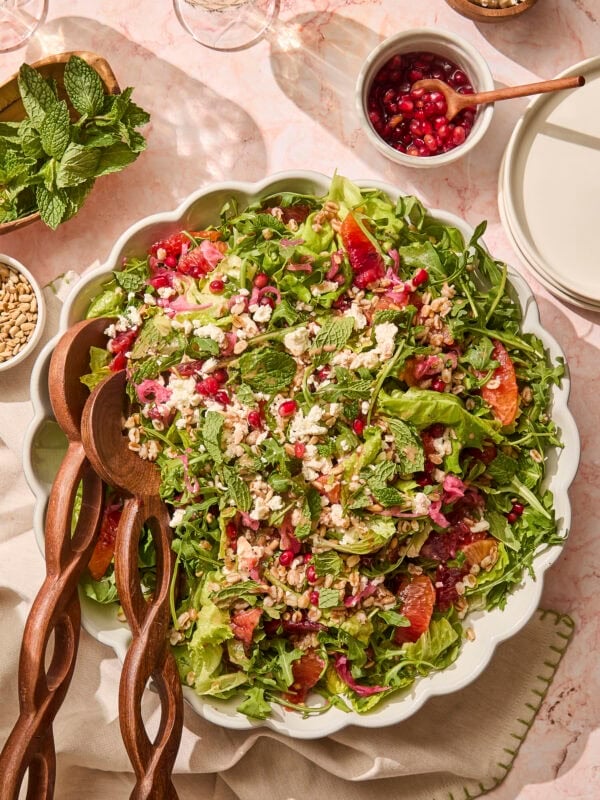 Large platter filled with farro salad with blood orange segments, pomegranates, feta, and more.
